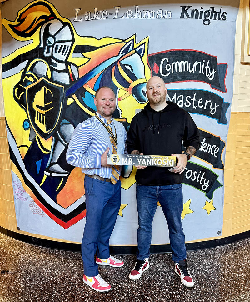 Principal taking a picture with Mr. Yankoski - Teacher of the Month for September 2025