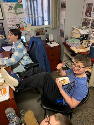 students at Principal's desk