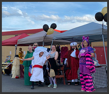 teachers posing together in costumes