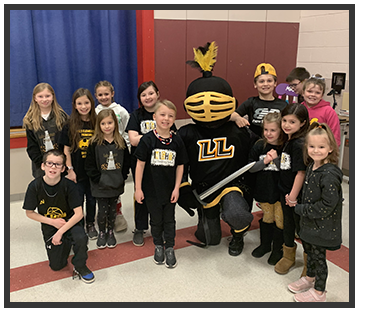 students around someone dressed in a knight costume