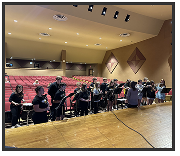 Students playing music with their instruments