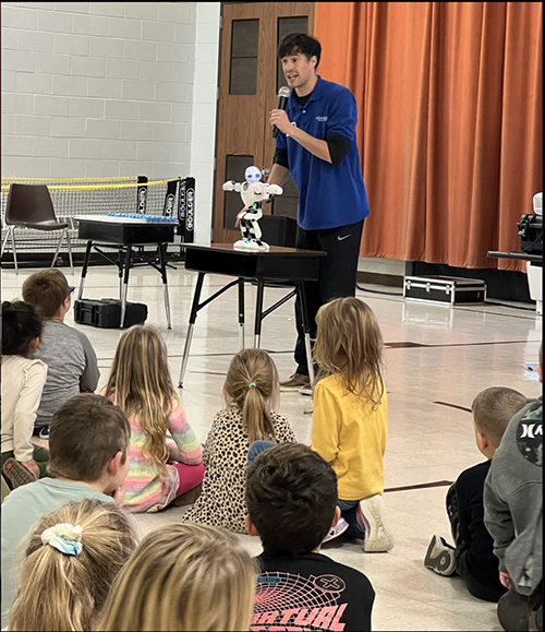 Students enjoying a robot assembly