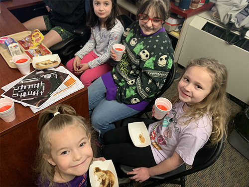 Group of happy students enjoying Principal Toast