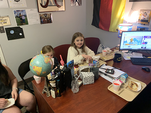 Two girl award recipients enjoying time with the principal