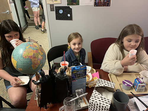 Group of students enjoying time with the principal