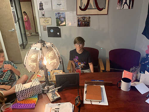 Students enjoying toast award in the principal's office