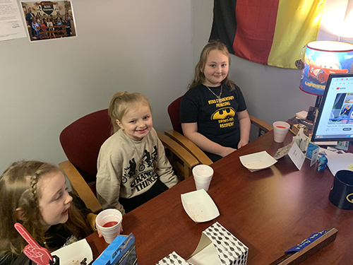 Happy students celebrating toast to a good student