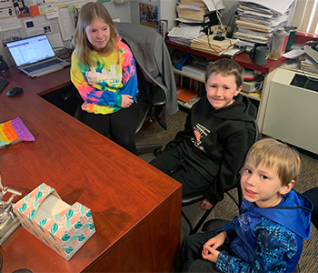 3 students smiling
