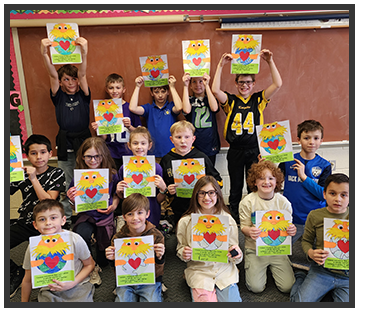 students holding up their artwork