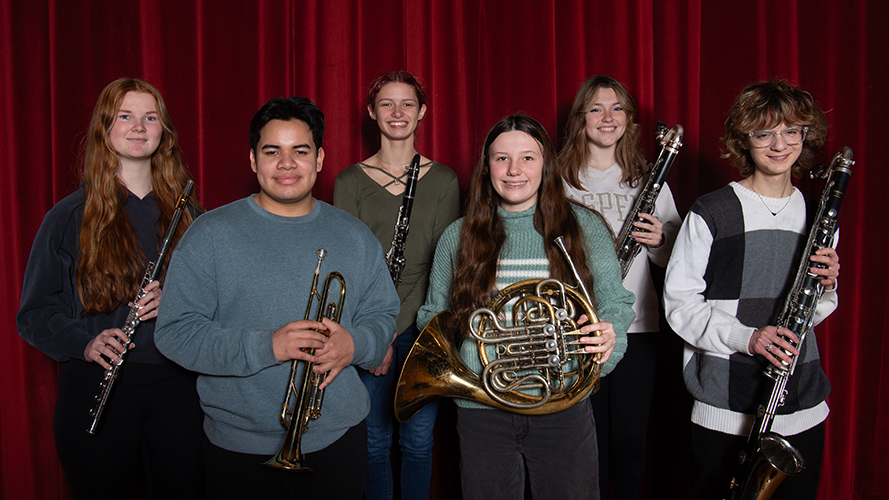 Group of musical students holding their instruments